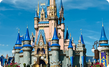 Cinderella Castle's blue towers and gold accents stand against a bright blue sky